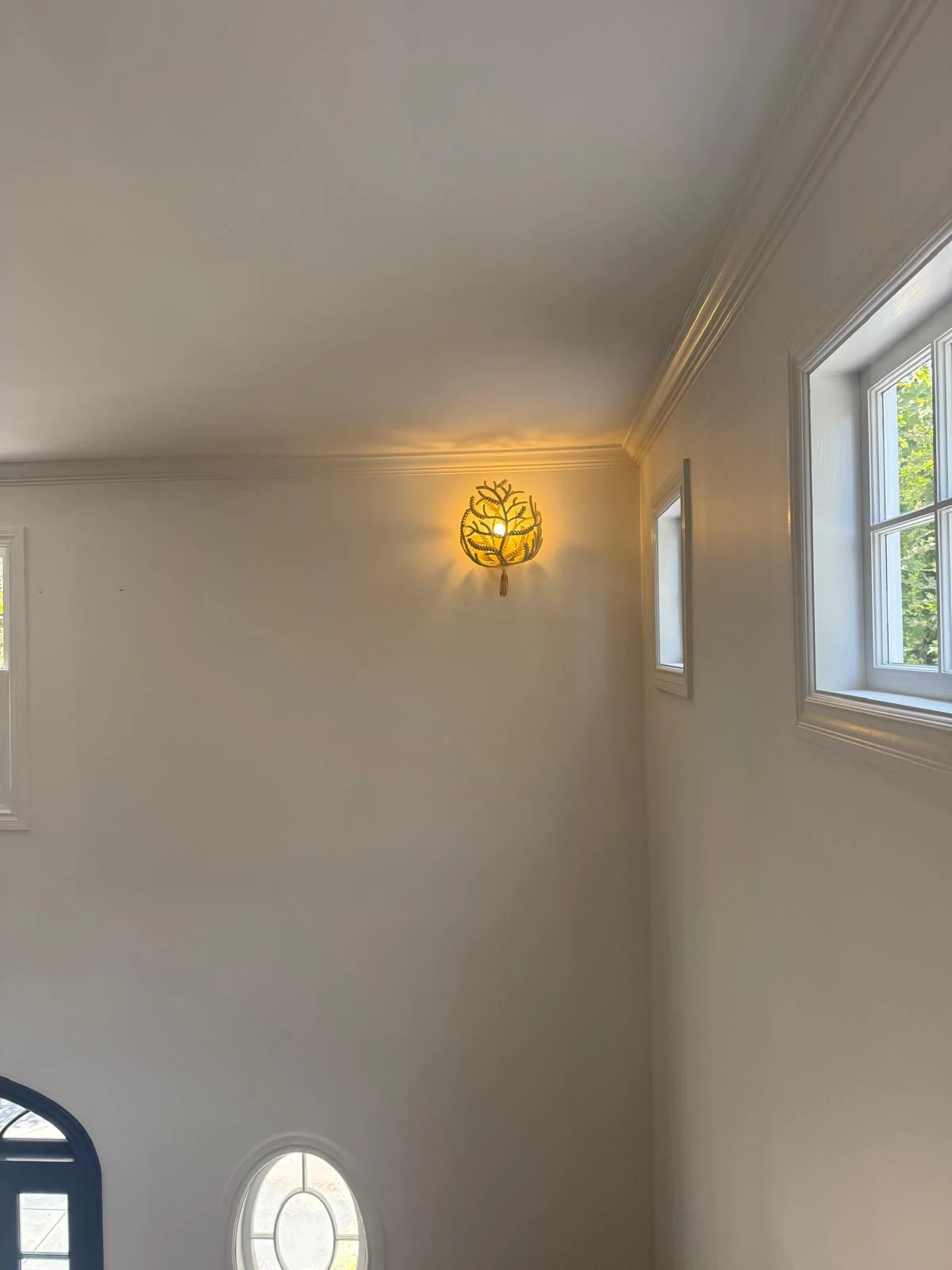 Decorative wall sconce light fixture installed in Los Angeles home